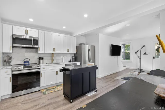 a kitchen with a stove and a microwave