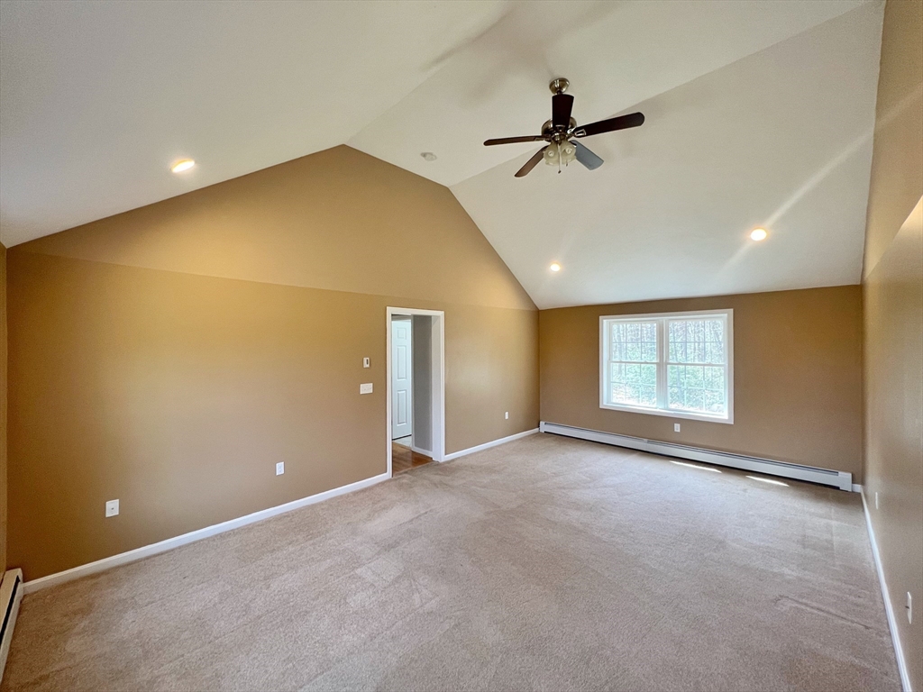 78 Bayberry Hill Road Townsend, MA 01474 - Photo 11 of 26 an empty room with windows and ceiling fan