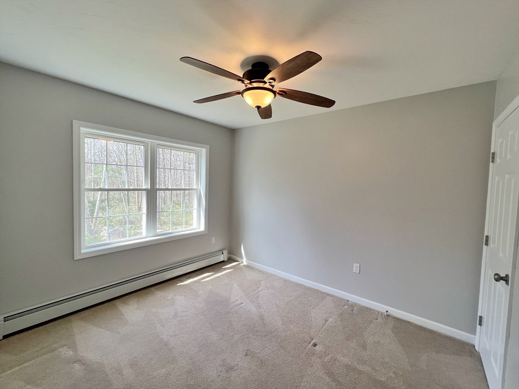 78 Bayberry Hill Road Townsend, MA 01474 - Photo 13 of 26 a view of an empty room with window and chandelier fan