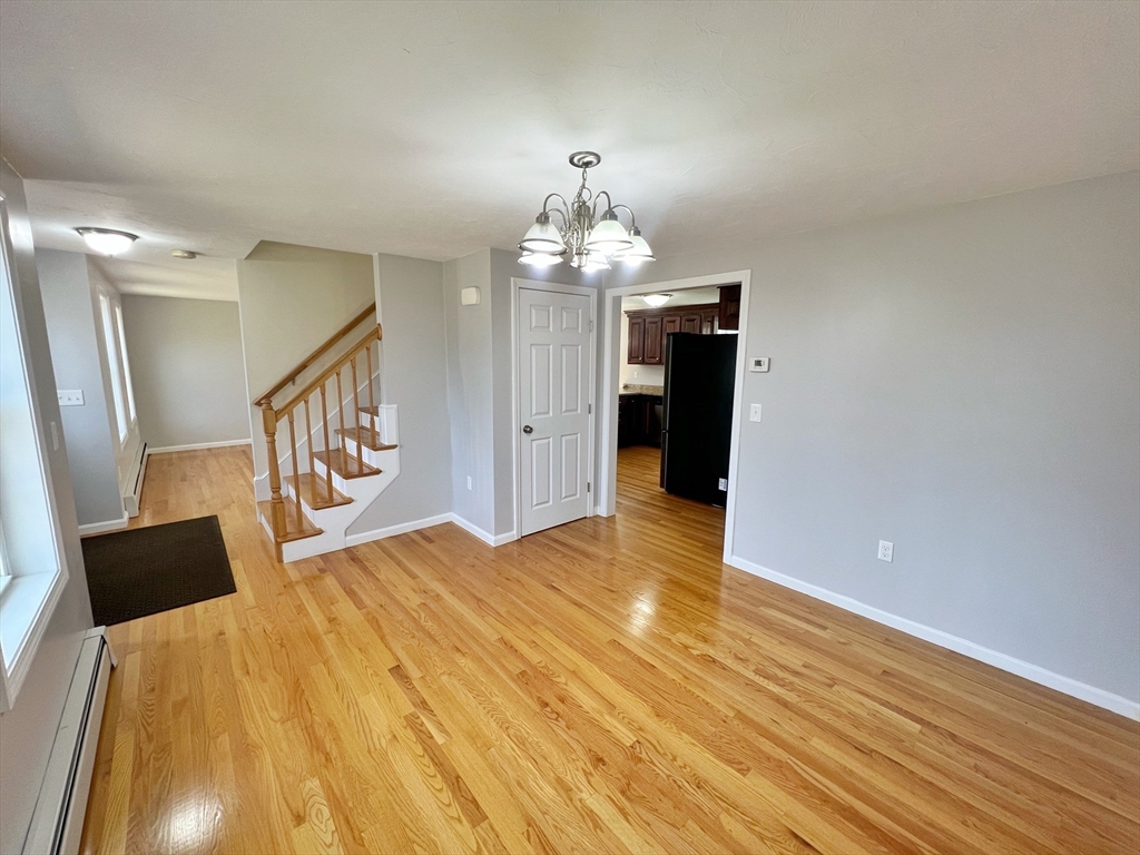 78 Bayberry Hill Road Townsend, MA 01474 - Photo 8 of 26 a bedroom with a bed and a chandelier