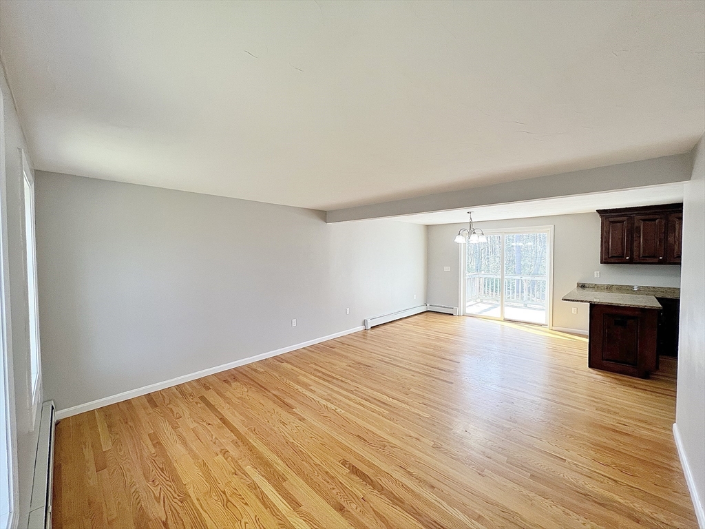 78 Bayberry Hill Road Townsend, MA 01474 - Photo 10 of 26 a view of empty room with wooden floor and fan