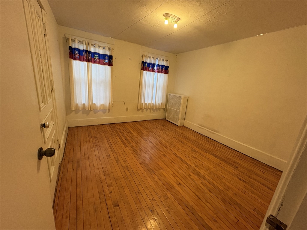 41 Amesbury Street Worcester, MA 01605 - Photo 11 of 17 a view of an empty room with a window