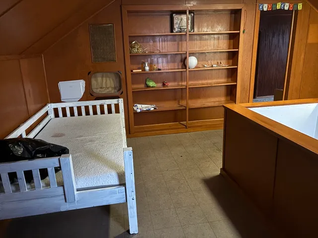 a view of wooden floor and windows in a room