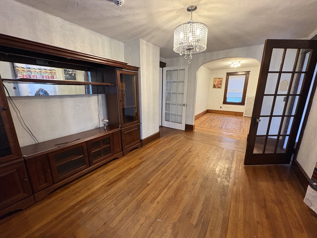 41 Amesbury Street Worcester, MA 01605 - Photo 3 of 17 a view of a hallway with wooden floor and stairs