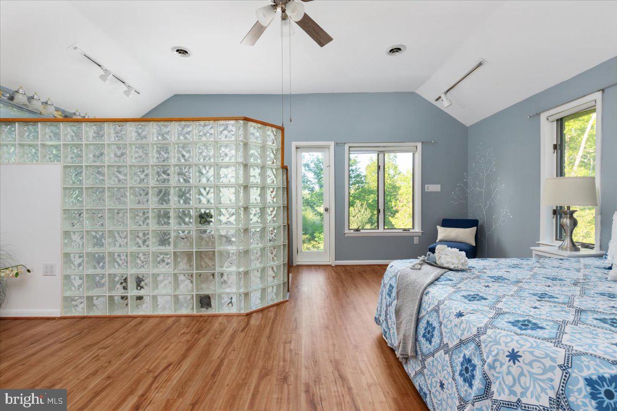 146 Lizzie Mills Road Castleton, VA 22716 - Photo 23 of 91 a bed sitting in a spacious bedroom next to a window