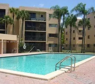 a view of a swimming pool with a yard