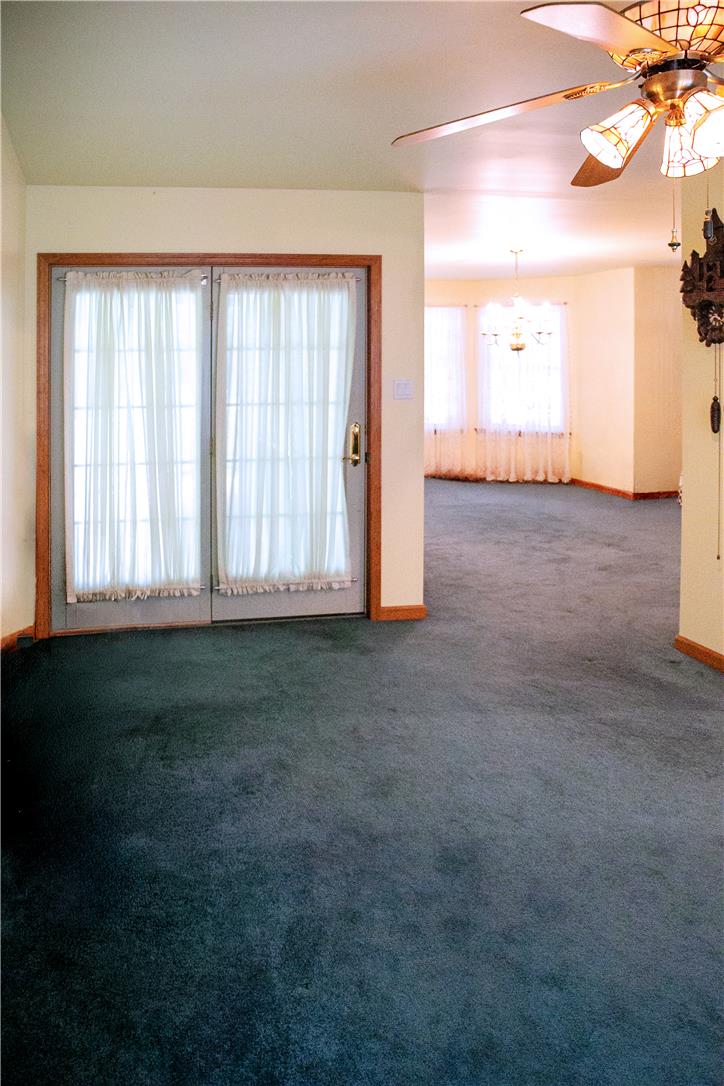 50 Anthony's Road White Haven, PA 18661 - Photo 23 of 57 A versatile living area with soft carpeting and double glass doors invites relaxation and natural light.