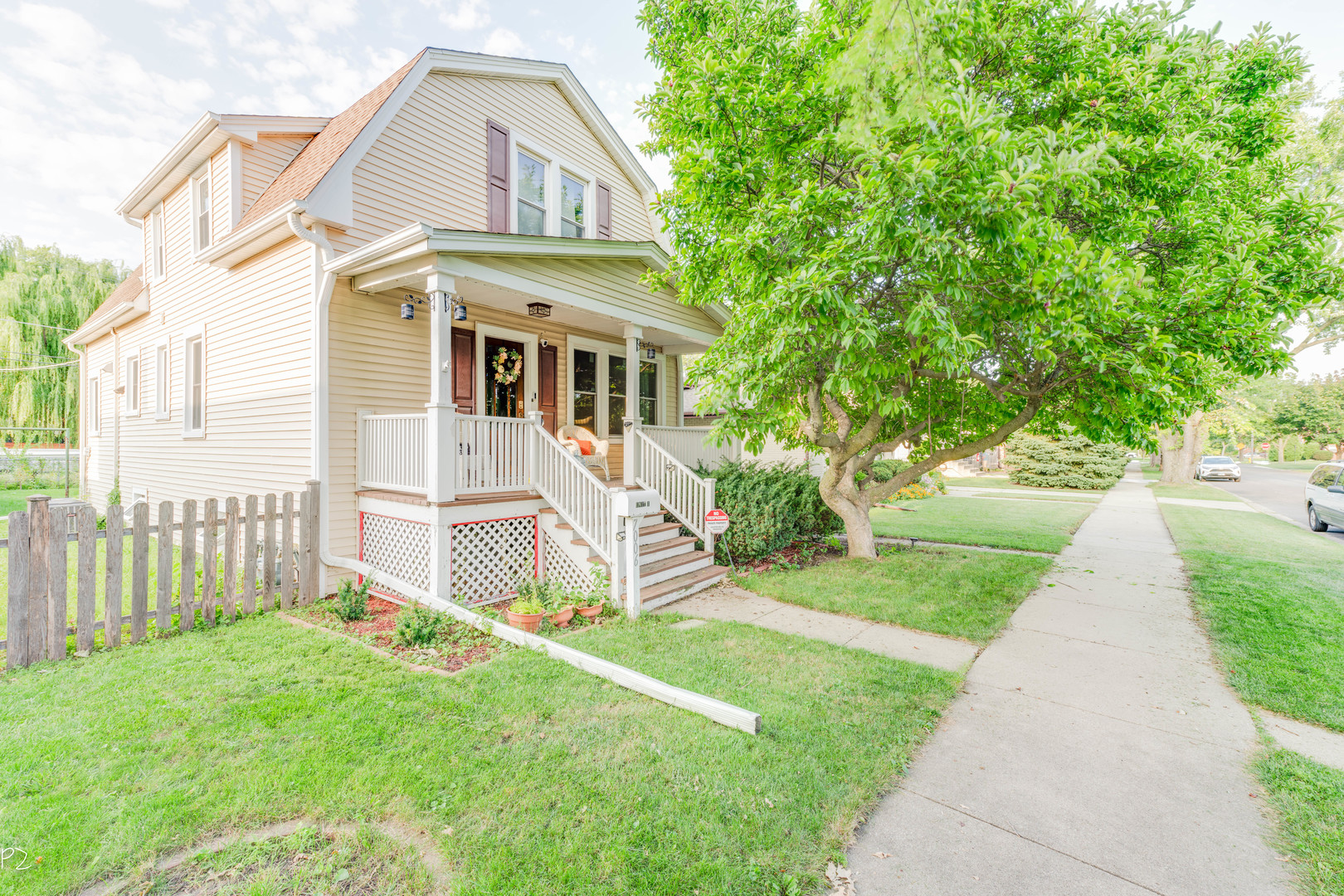 7006 West Jarvis Avenue Niles, IL 60714 - Photo 1 of 34 a front view of a house with a yard