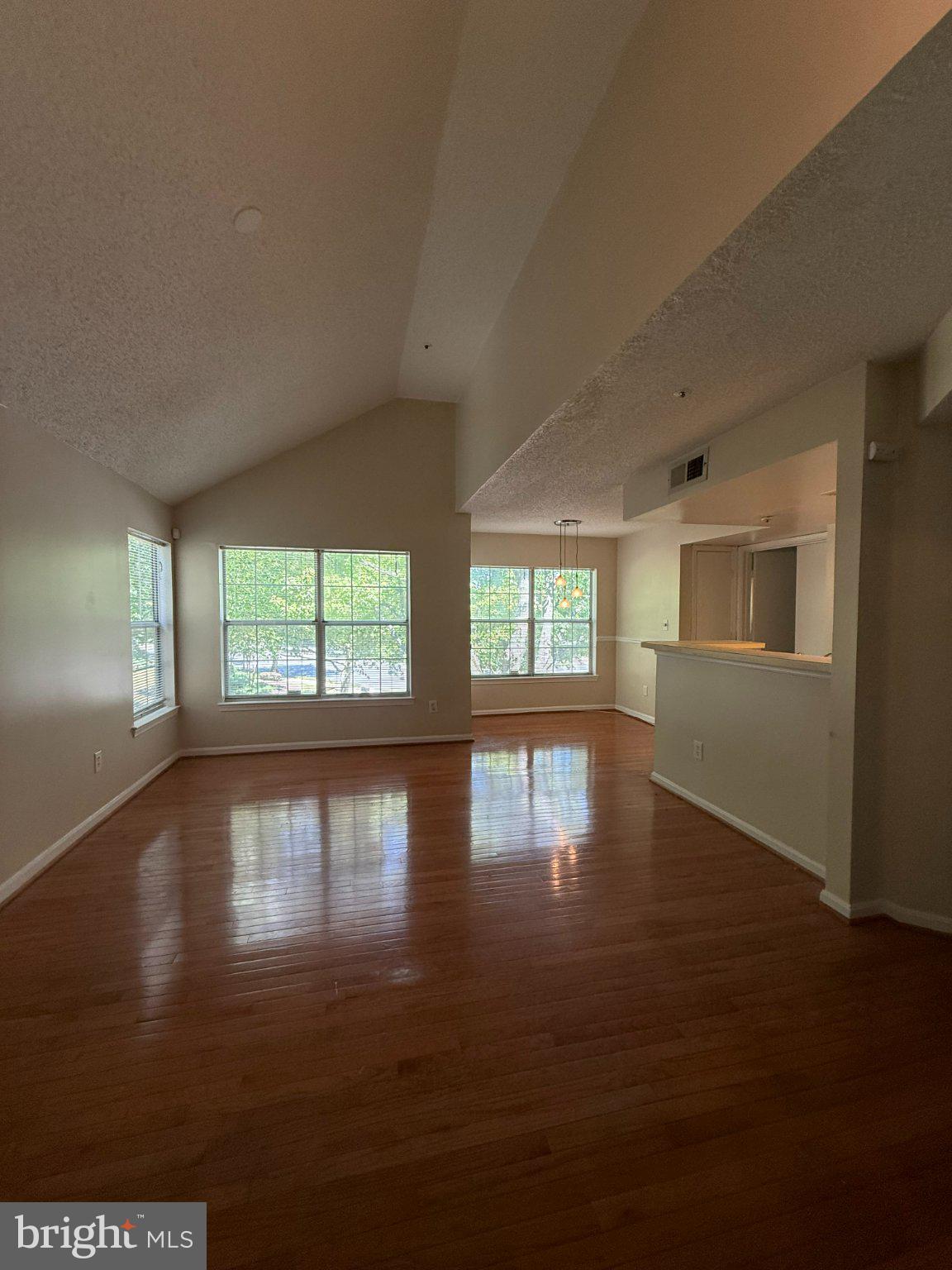 10510 Beacon Ridge Drive, Unit 14202 Bowie, MD 20721 - Photo 9 of 17 Spacious living area with natural light.