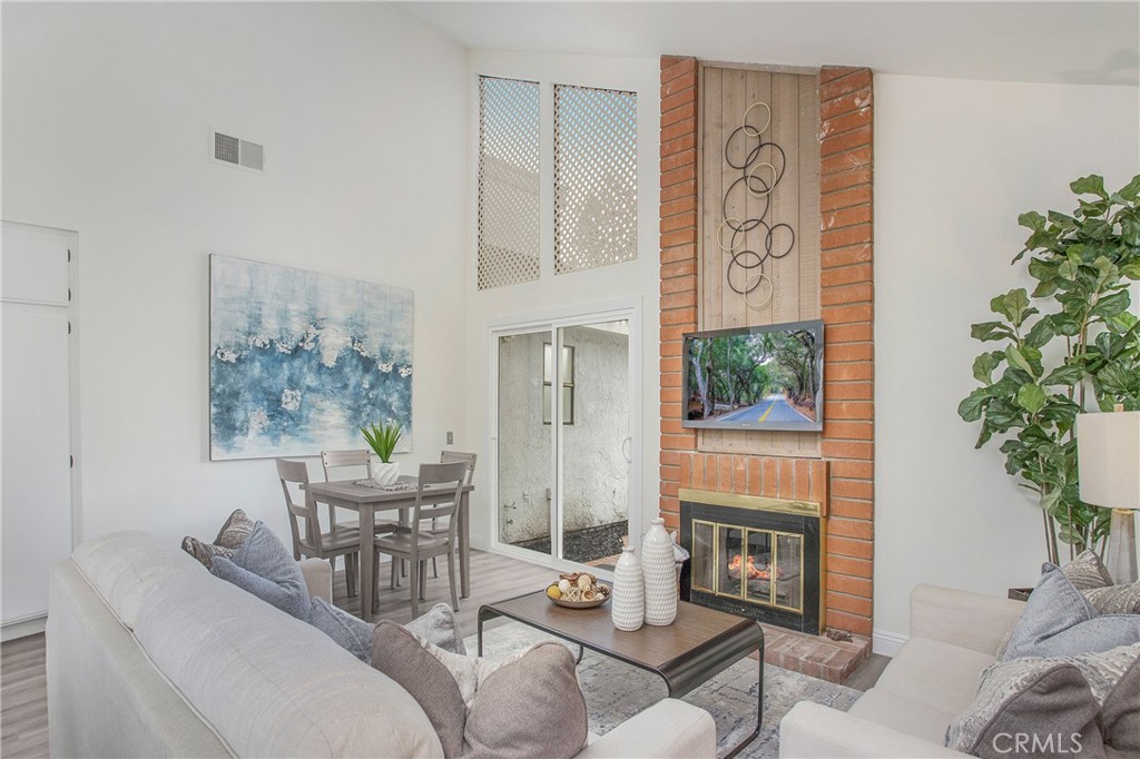 11 Ensueno Irvine, CA 92620 - Photo 14 of 36 a living room with furniture and a potted plant