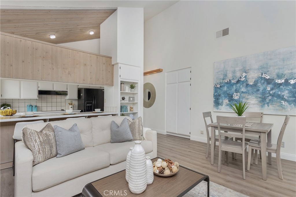 11 Ensueno Irvine, CA 92620 - Photo 15 of 36 a living room with furniture and a flat screen tv