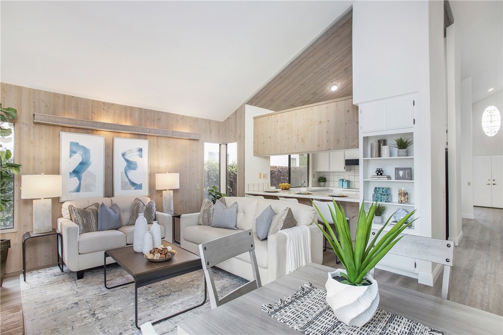 11 Ensueno Irvine, CA 92620 - Photo 16 of 36 a living room with furniture a chandelier and a dining table