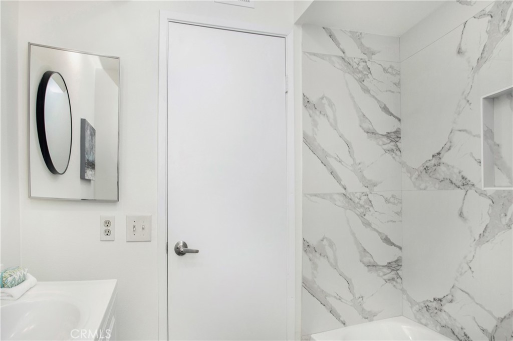 11 Ensueno Irvine, CA 92620 - Photo 19 of 36 a bathroom with a sink and a mirror