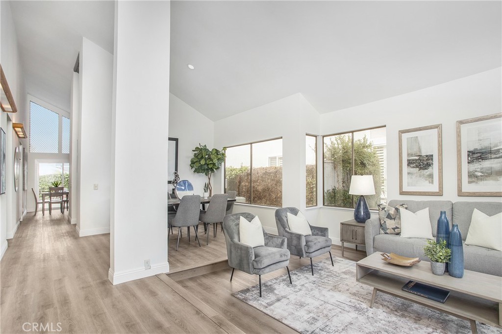 11 Ensueno Irvine, CA 92620 - Photo 2 of 36 a living room with furniture and a large window