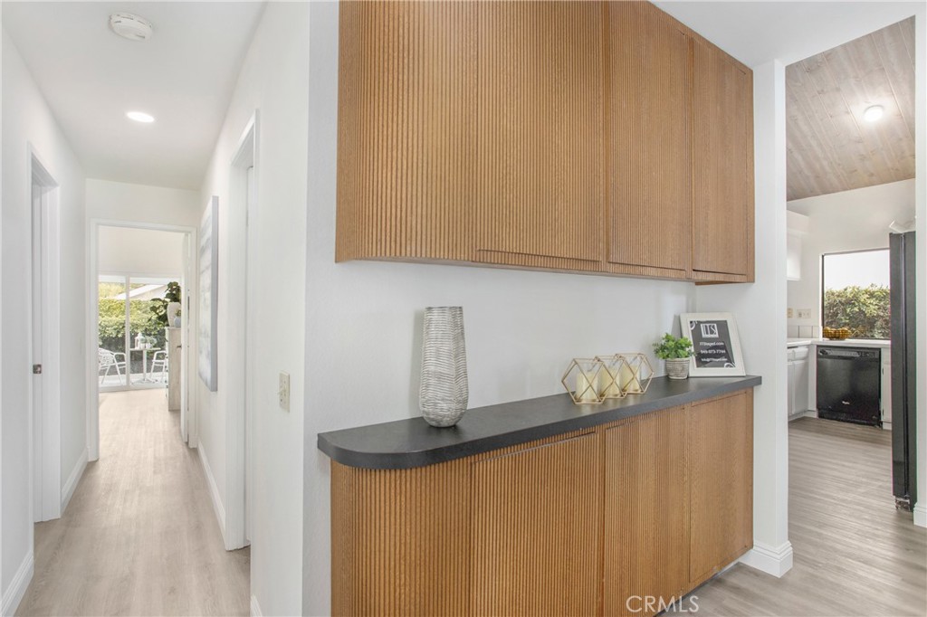11 Ensueno Irvine, CA 92620 - Photo 25 of 36 a kitchen with stainless steel appliances granite countertop a stove a sink a refrigerator and white cabinets