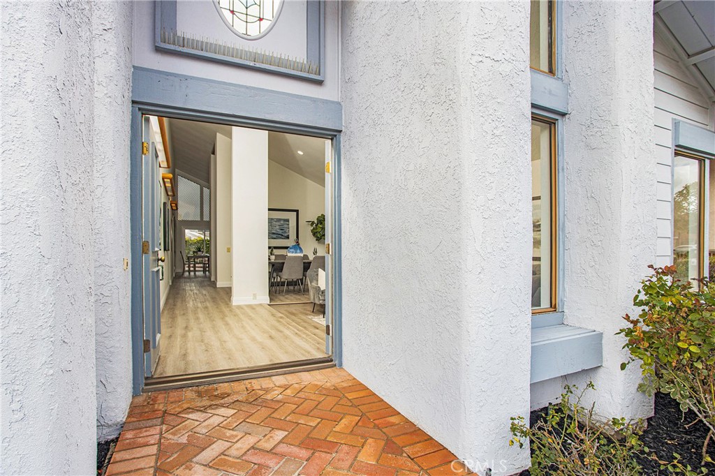 11 Ensueno Irvine, CA 92620 - Photo 31 of 36 a view of a hallway to a livingroom with furniture