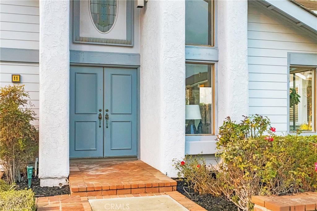 11 Ensueno Irvine, CA 92620 - Photo 35 of 36 a view of yellow house with potted plants
