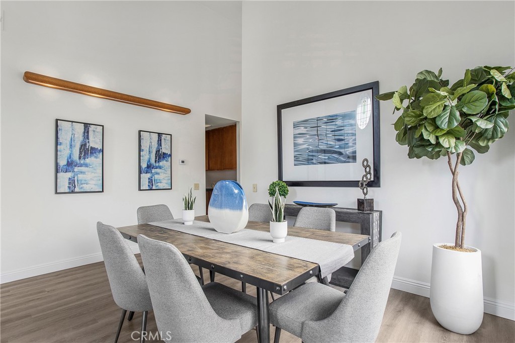 11 Ensueno Irvine, CA 92620 - Photo 5 of 36 a view of a dining room with furniture and wooden floor