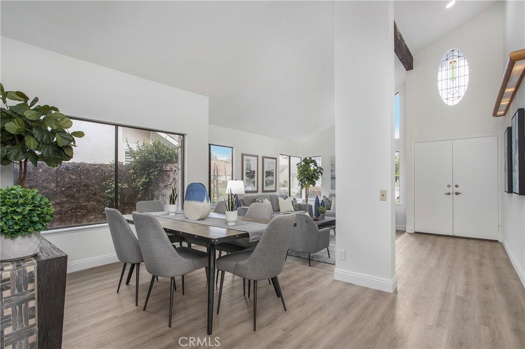 11 Ensueno Irvine, CA 92620 - Photo 6 of 36 a view of a dining room with furniture window and wooden floor