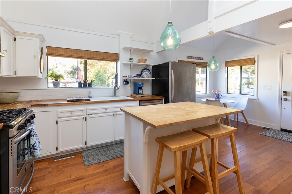 28344 Water Way Silverado, CA 92676 - Photo 19 of 34 a kitchen with a table chairs refrigerator and window