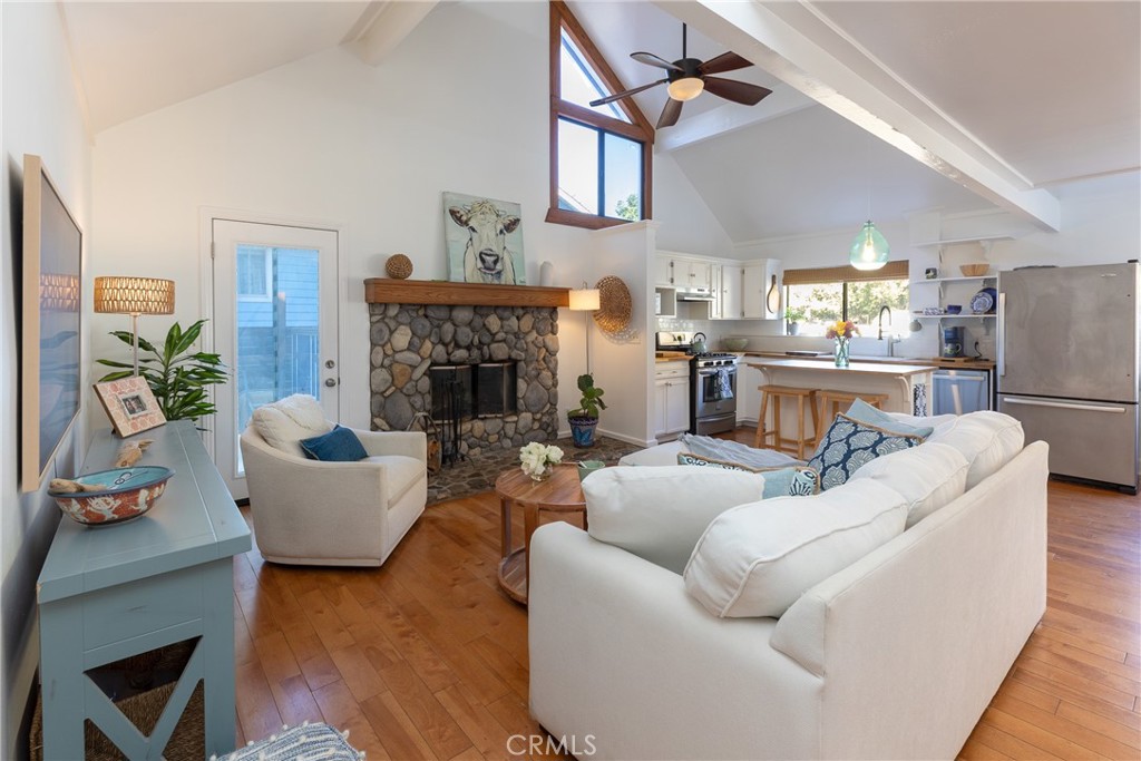 28344 Water Way Silverado, CA 92676 - Photo 2 of 34 a living room with furniture a fireplace and a chandelier