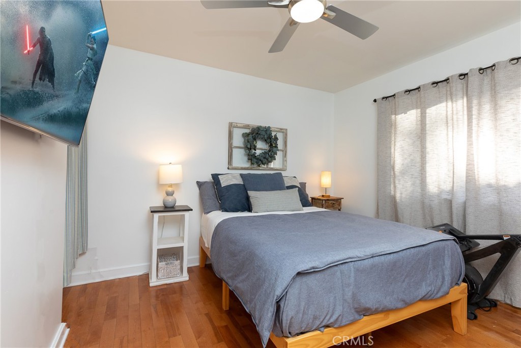 28344 Water Way Silverado, CA 92676 - Photo 21 of 34 a bedroom with a bed and a chandelier