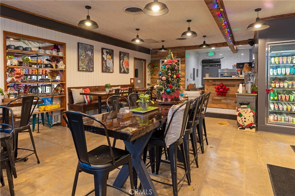 28344 Water Way Silverado, CA 92676 - Photo 29 of 34 a dining room with lots of furniture and lots of wooden floor