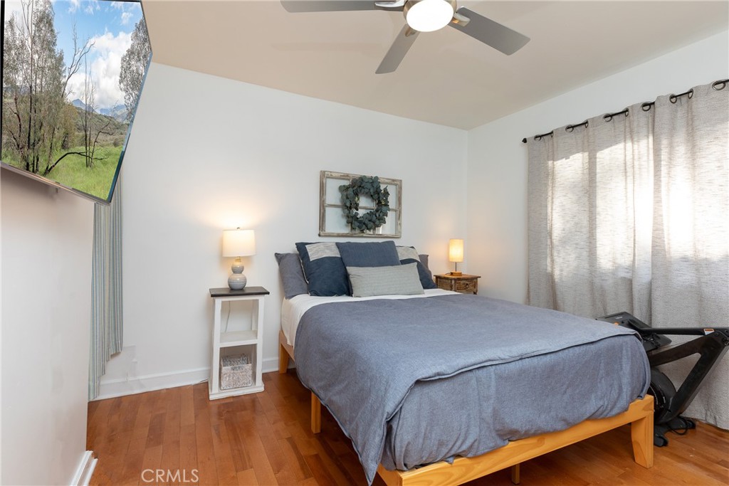 28344 Water Way Silverado, CA 92676 - Photo 5 of 34 a bedroom with a bed lamp and a large window