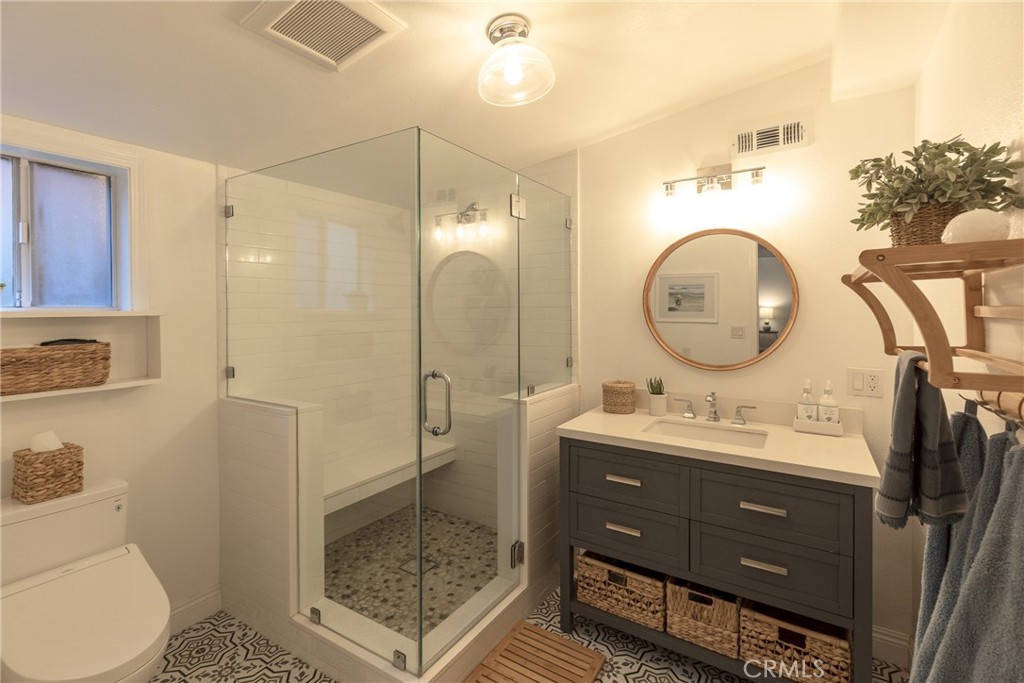 28344 Water Way Silverado, CA 92676 - Photo 6 of 34 a bathroom with a double vanity sink mirror toilet and shower