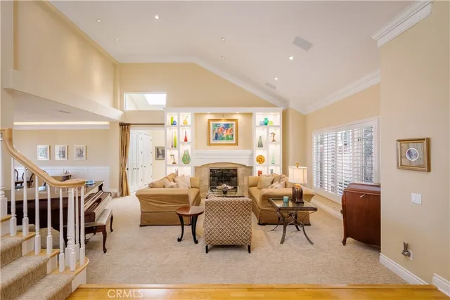 a bedroom with furniture and a large window