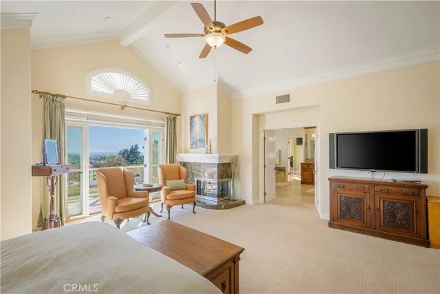 a large kitchen with kitchen island granite countertop a large window and a view of living room