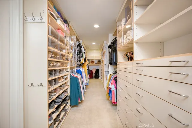 a view of a bedroom with workspace and a window