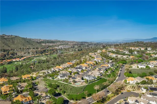 a view of residential houses with outdoor space and river