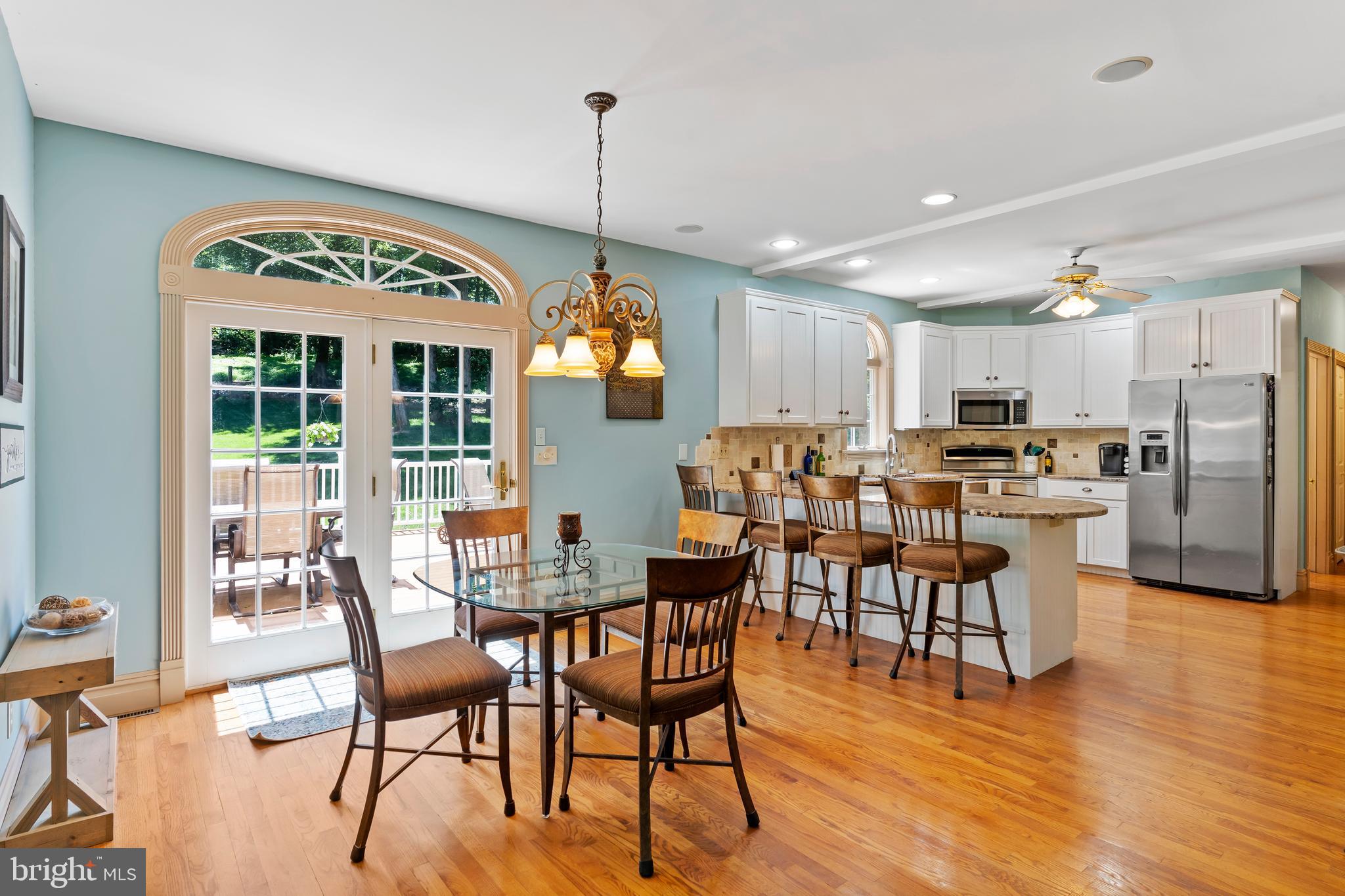 176 Richland Road Carlisle, PA 17015 - Photo 10 of 59 a view of a dining room and livingroom with furniture wooden floor a chandelier
