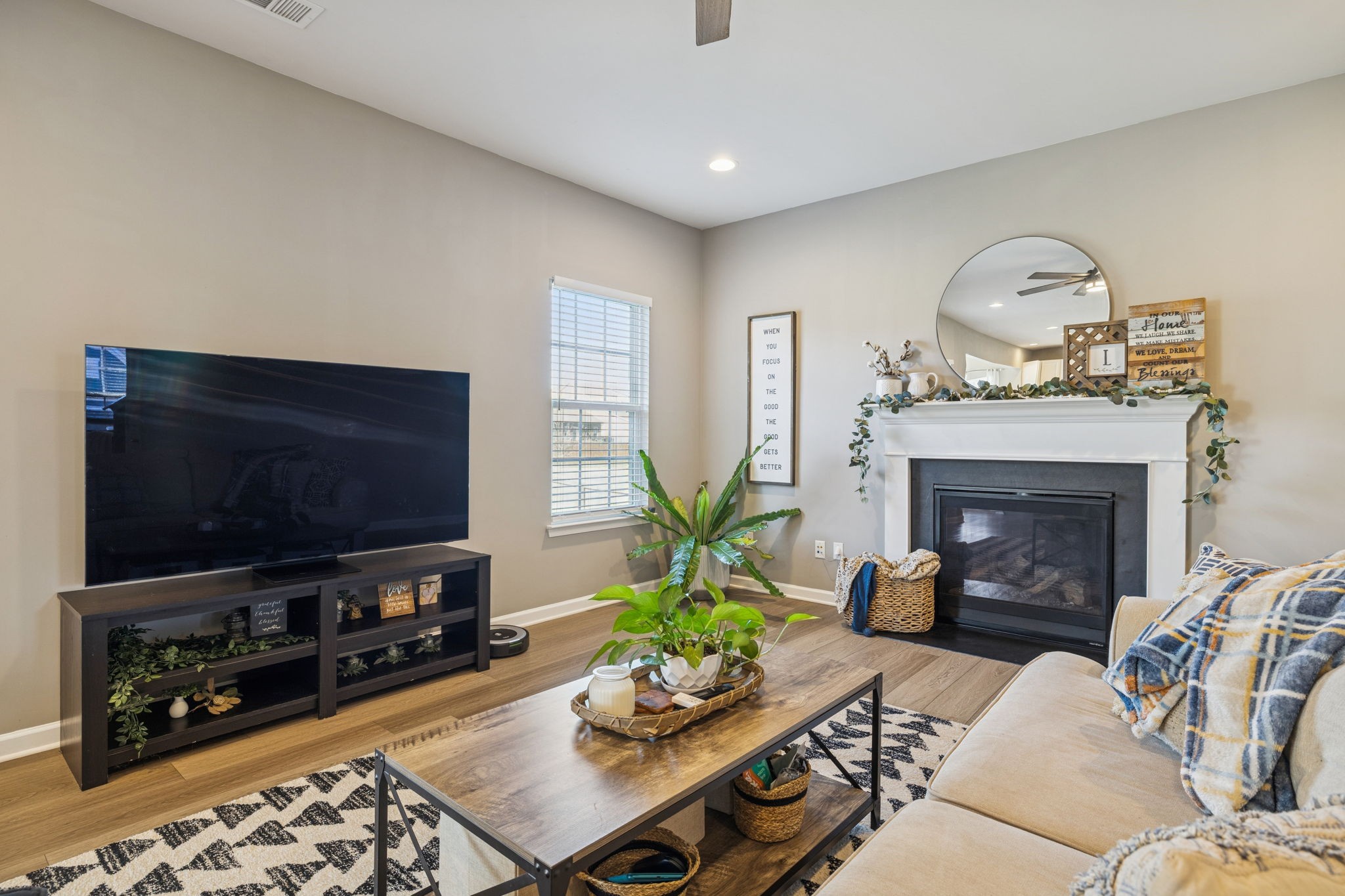 140 Hackney Lane Gallatin, TN 37066 - Photo 13 of 66 a living room with furniture a fireplace and a flat screen tv
