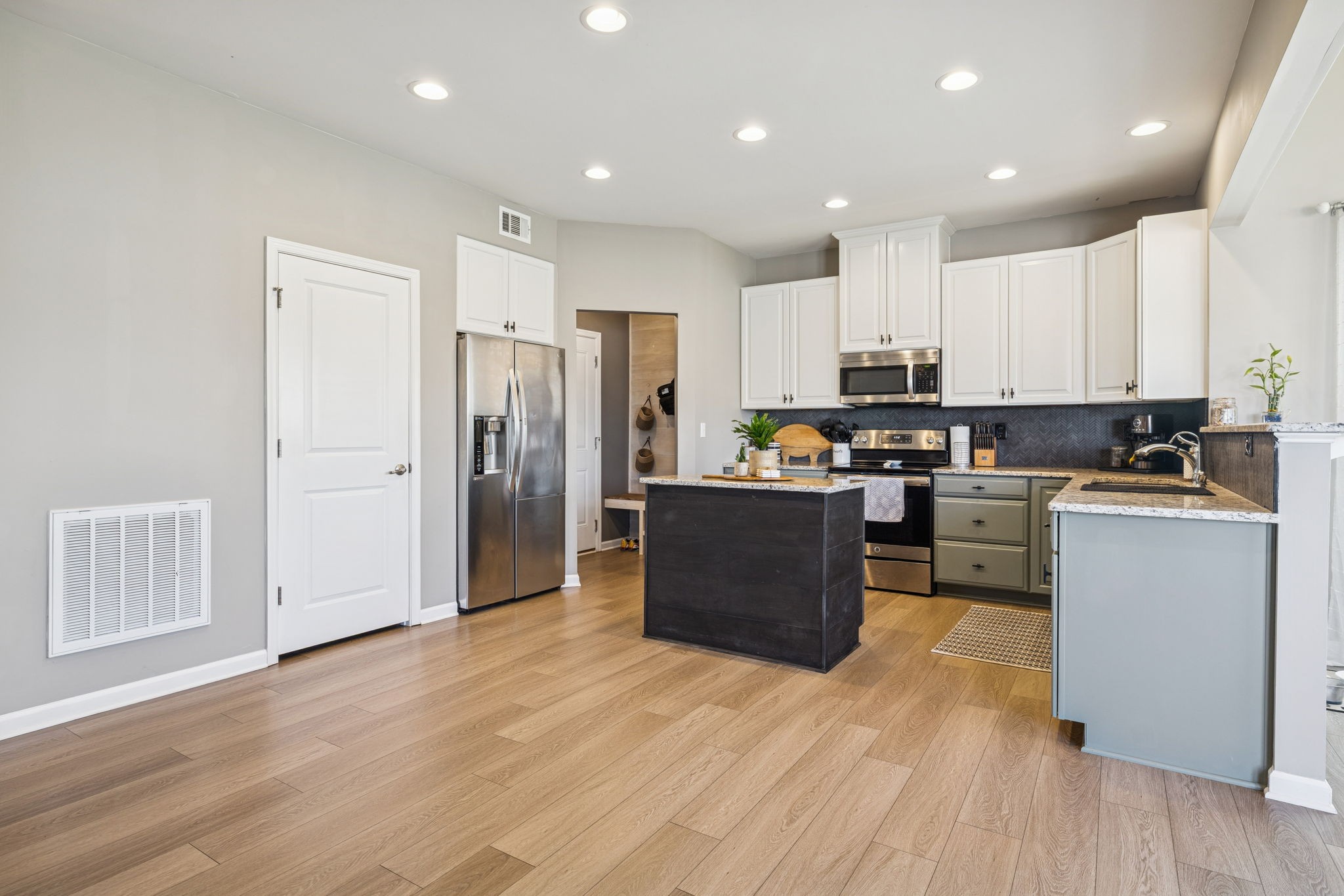 140 Hackney Lane Gallatin, TN 37066 - Photo 16 of 66 a kitchen with stainless steel appliances granite countertop a refrigerator stove top oven and cabinets