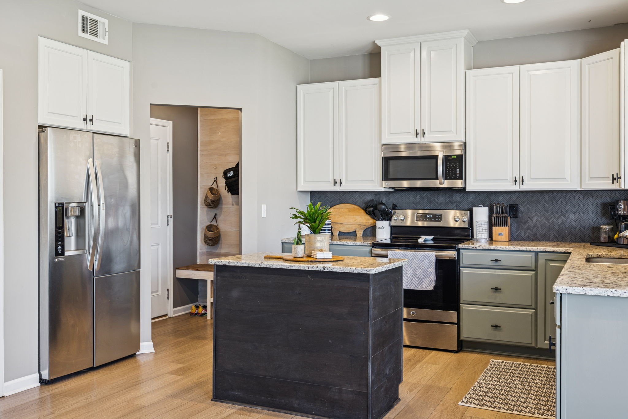 140 Hackney Lane Gallatin, TN 37066 - Photo 19 of 66 a kitchen with stainless steel appliances granite countertop a refrigerator a stove a sink and white cabinets