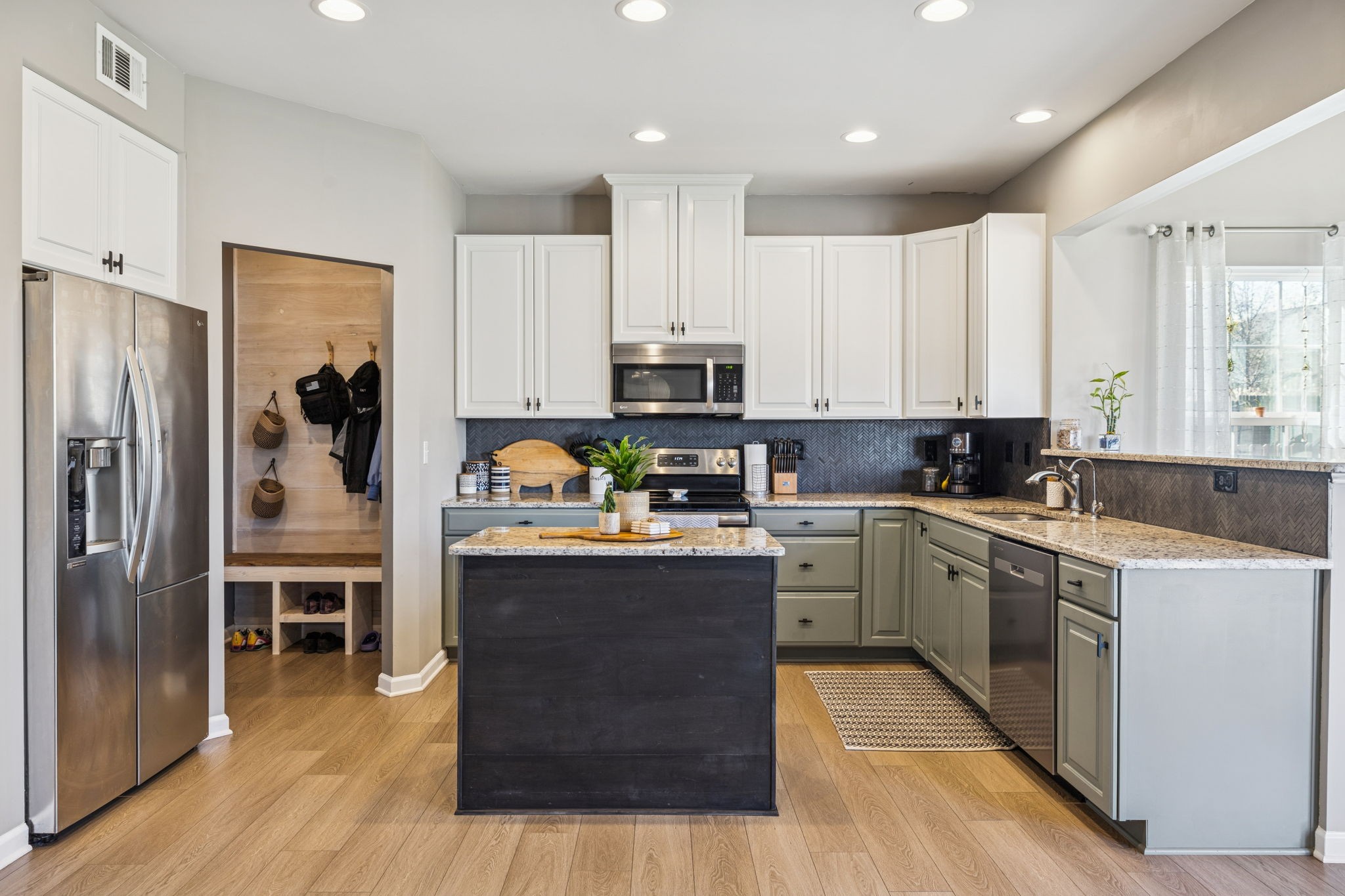 140 Hackney Lane Gallatin, TN 37066 - Photo 20 of 66 a kitchen with wooden cabinets and stainless steel appliances