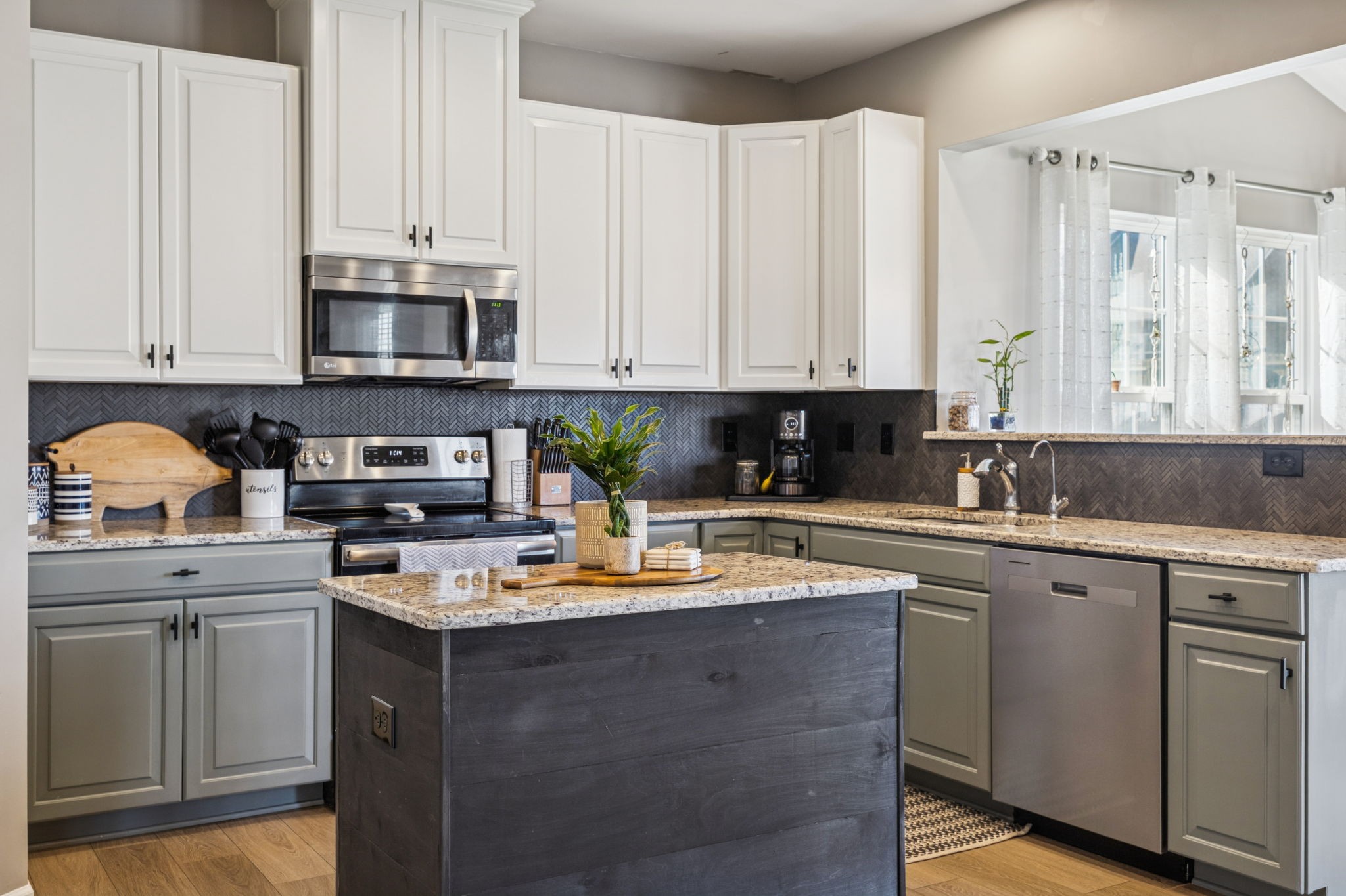 140 Hackney Lane Gallatin, TN 37066 - Photo 22 of 66 a kitchen with stainless steel appliances granite countertop white cabinets sink and stove