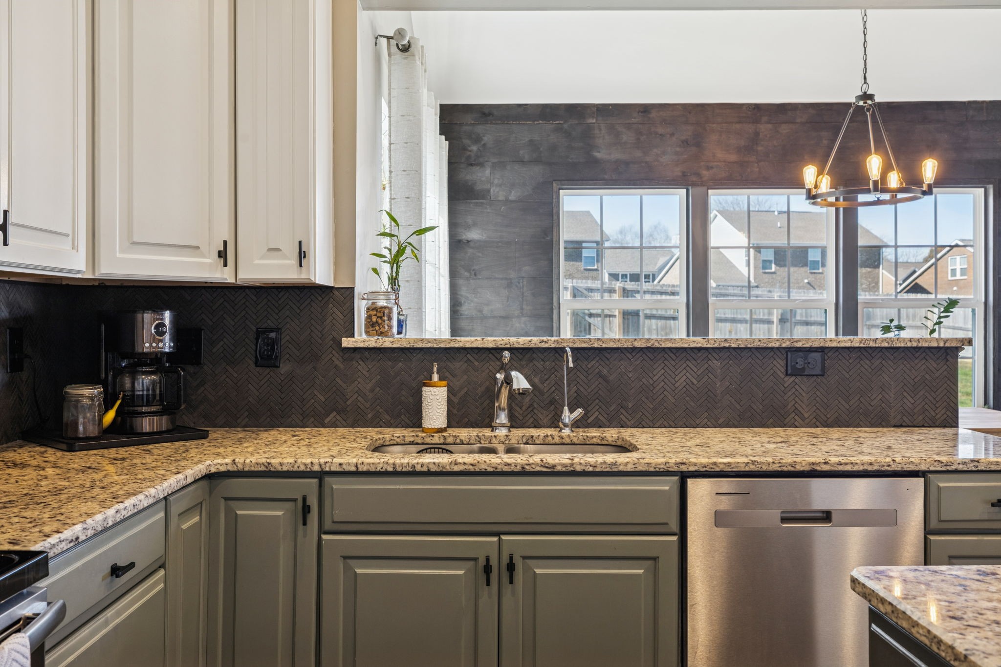 140 Hackney Lane Gallatin, TN 37066 - Photo 25 of 66 a kitchen with granite countertop a sink a window and stainless steel appliances