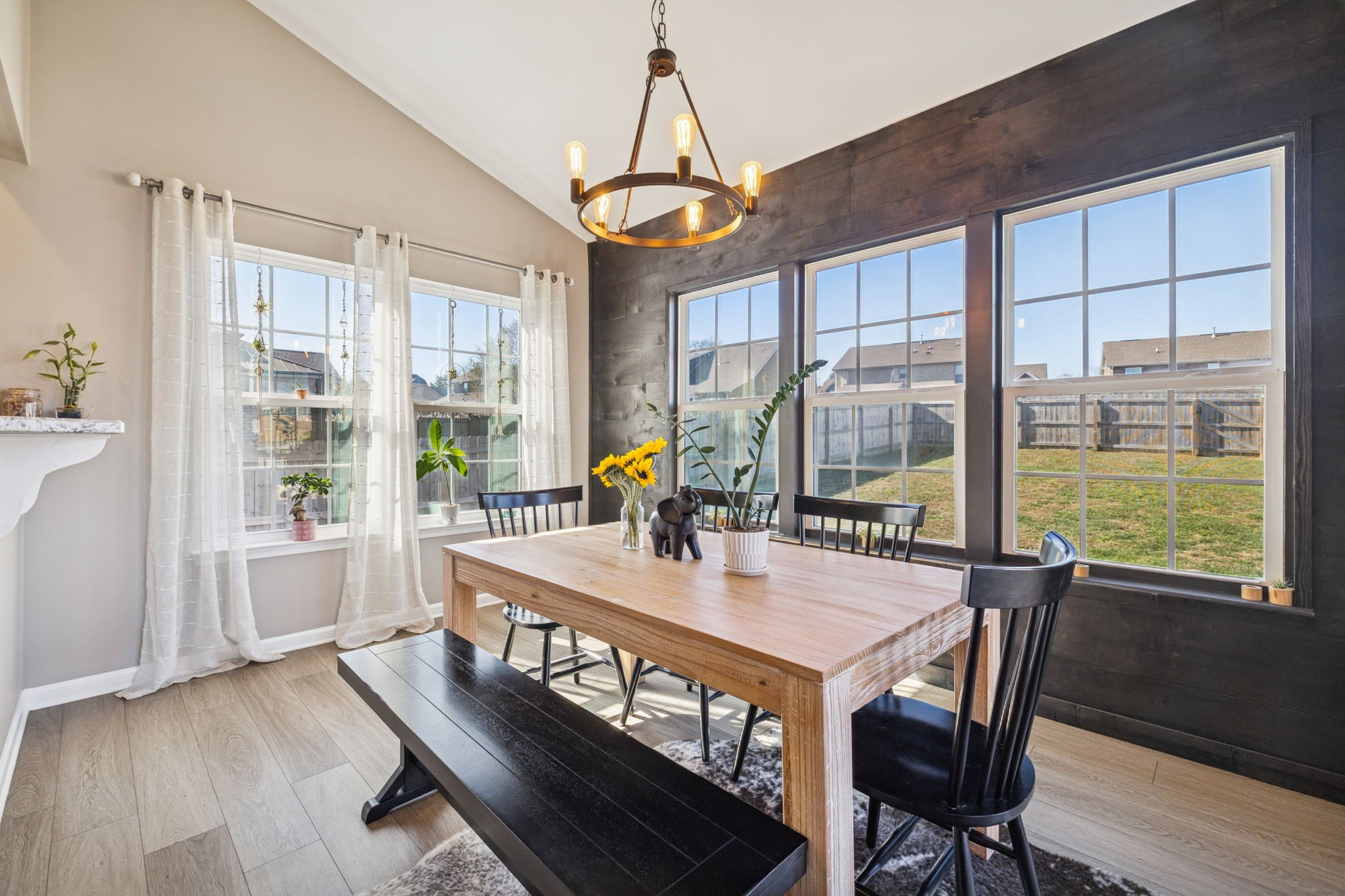 140 Hackney Lane Gallatin, TN 37066 - Photo 31 of 66 a dining room with wooden floor a chandelier a glass table and chairs