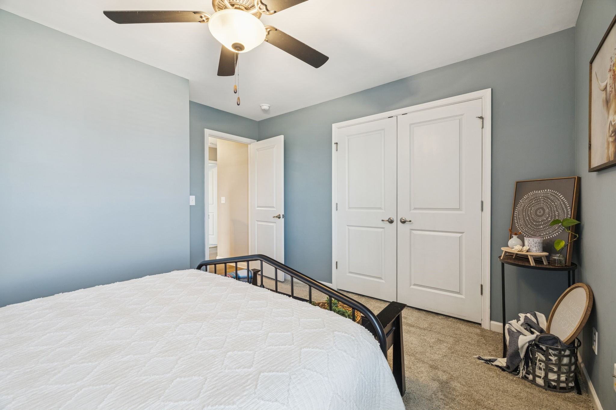 140 Hackney Lane Gallatin, TN 37066 - Photo 39 of 66 a bedroom with a bed and a chandelier