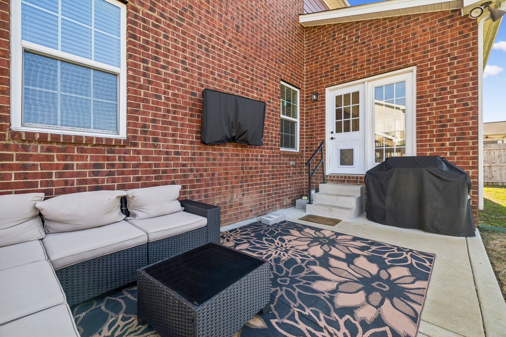 140 Hackney Lane Gallatin, TN 37066 - Photo 59 of 66 a view of a patio with couches chairs and a flat screen tv