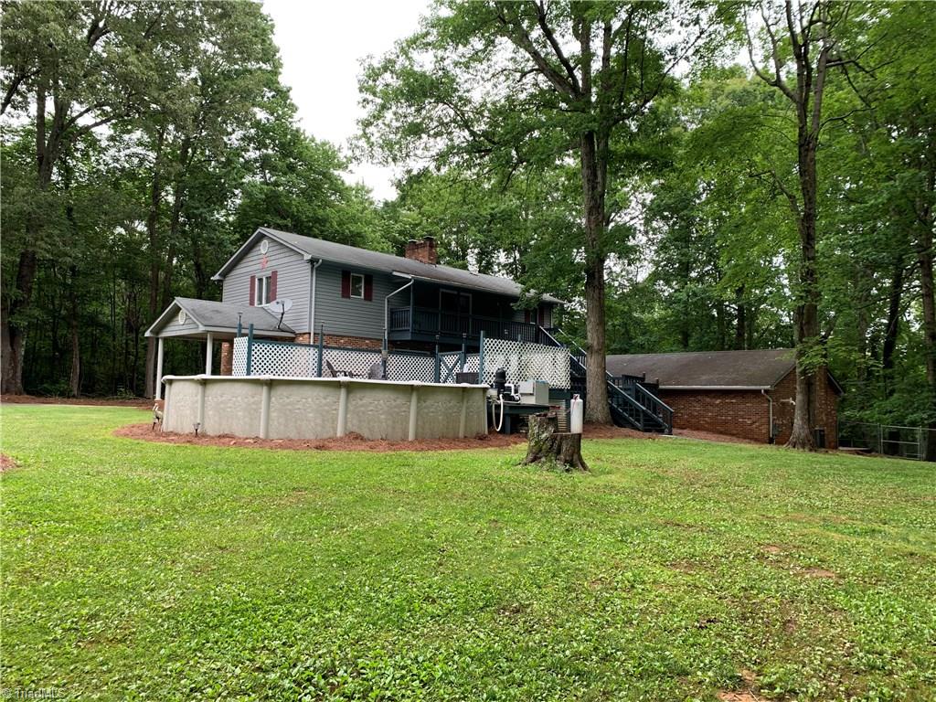 310 Paso Street Rural Hall, NC 27045 - Photo 29 of 30 back with view of oversized garage & fenced yard for the dogs over looks the woods