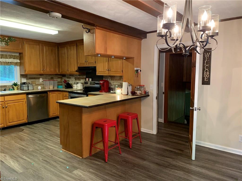 310 Paso Street Rural Hall, NC 27045 - Photo 7 of 30 large eat-in kitchen with SS appliances, new vinyl plank flooring