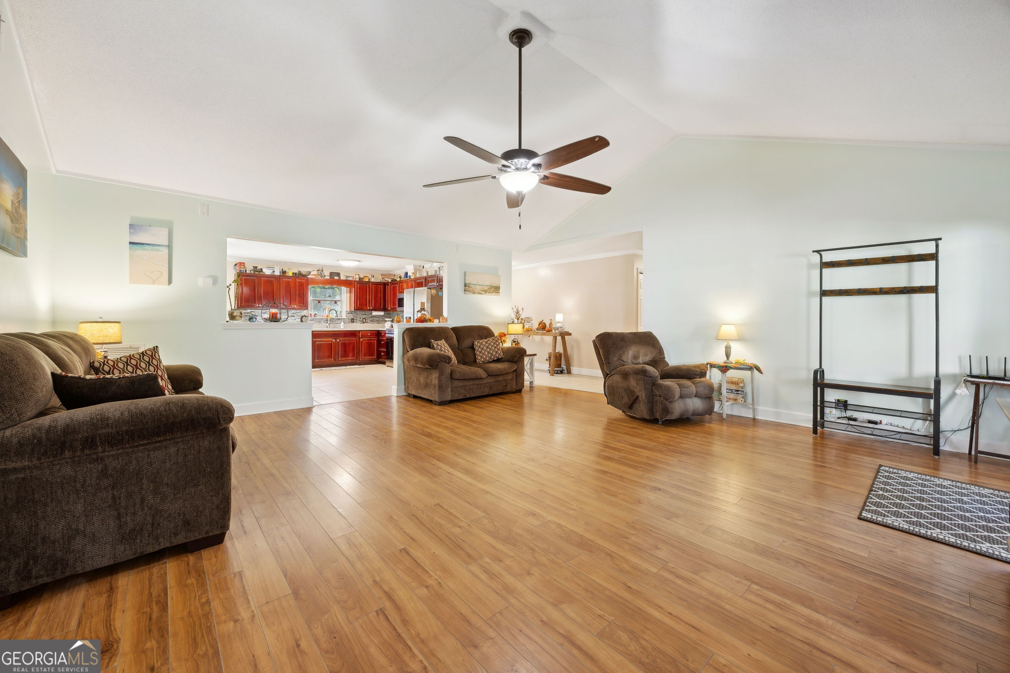 381 Powderhorn Road St. Marys, GA 31558 - Photo 11 of 37 a living room with furniture and a wooden floor