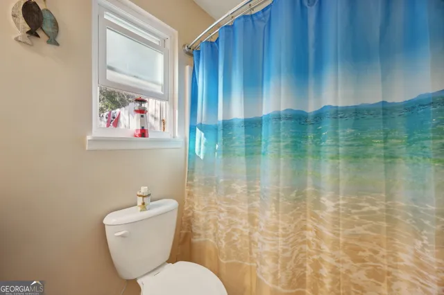 a bathroom with a toilet and sink