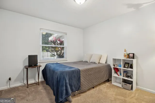 a bedroom with a bed and a cabinets