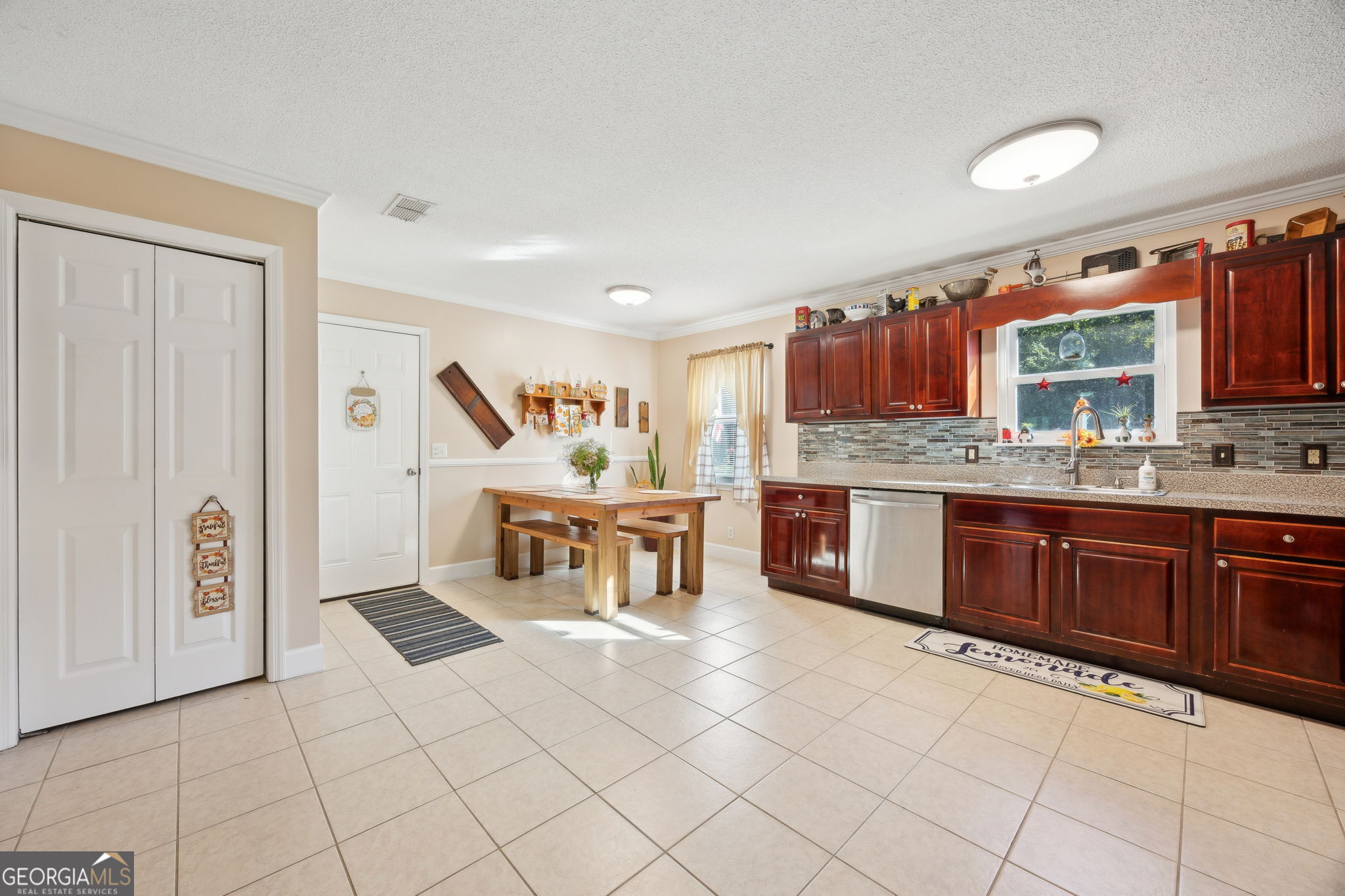 381 Powderhorn Road St. Marys, GA 31558 - Photo 7 of 37 a kitchen with stainless steel appliances a sink and a refrigerator