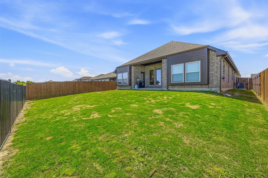 800 Jaguar Ridge Godley, TX 76044 - Photo 21 of 23 a large house with a big yard and large trees